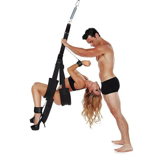 A man and woman doing a split on a Whip Smart Bondage Pleasure Swing for ultimate pleasure