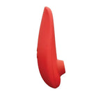 Red, curved Womanizer Classic 2 Marie Monroe Special Edition in teardrop shape