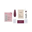 Womanizer Classic 2 Rechargeable Air Stimulator contents with wine and wine opener displayed