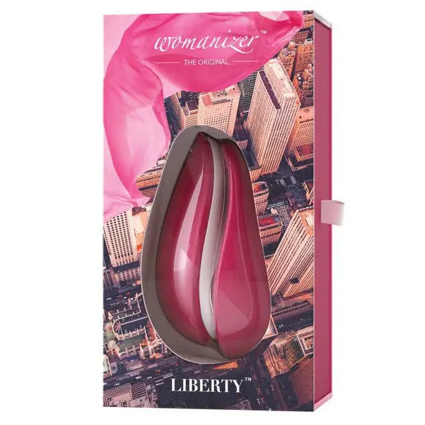 The original lip gloss displayed with Womanizer LIBERTY Air Clitoral Stimulator