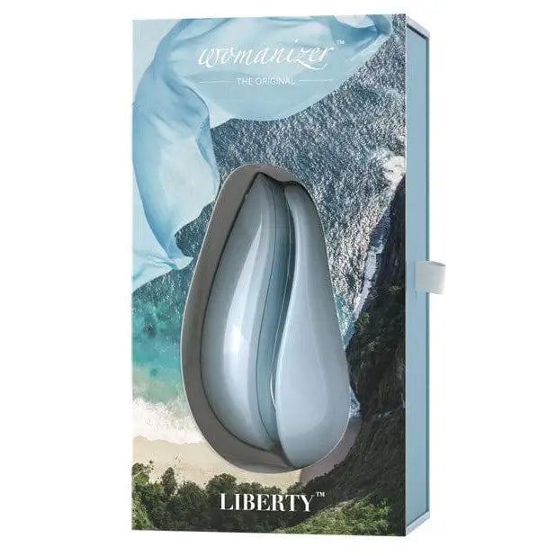 Close up of Womanizer LIBERTY Air box and perfume bottle