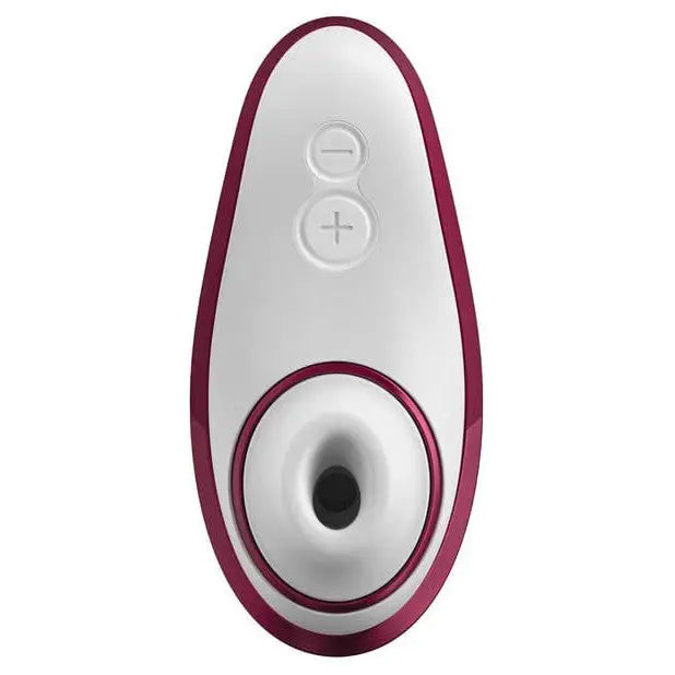 Close-up of Womanizer LIBERTY Air device showing white and red button for easy use