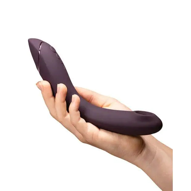 Womanizer Og Long-handle aubergine massager, pleasure air held in hand