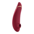 Close-up of Womanizer PREMIUM 2 Air Stimulator, red with gold band, showcasing pleasure air technology