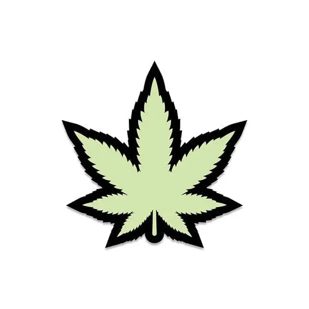 Stylized green pot leaf pin from Wood Rocket glows in the dark with black outline