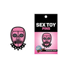 The Simpsons Pin Set featuring pink glitter displayed with Wood Rocket Sex Toy Bondage Mask