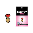 Wood Rocket heart butt plug pin - a playful and stylish sex toy accessory badge