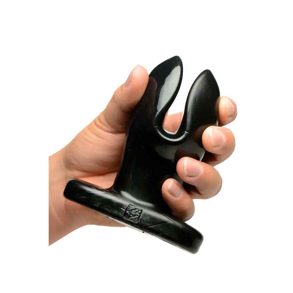 Hand holding Ass Anchor Flared Anal Plug for enhanced pleasure and comfort