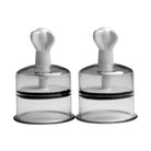 Two clear glass salt shakers with black lids from Xl Nipple Suckers collection